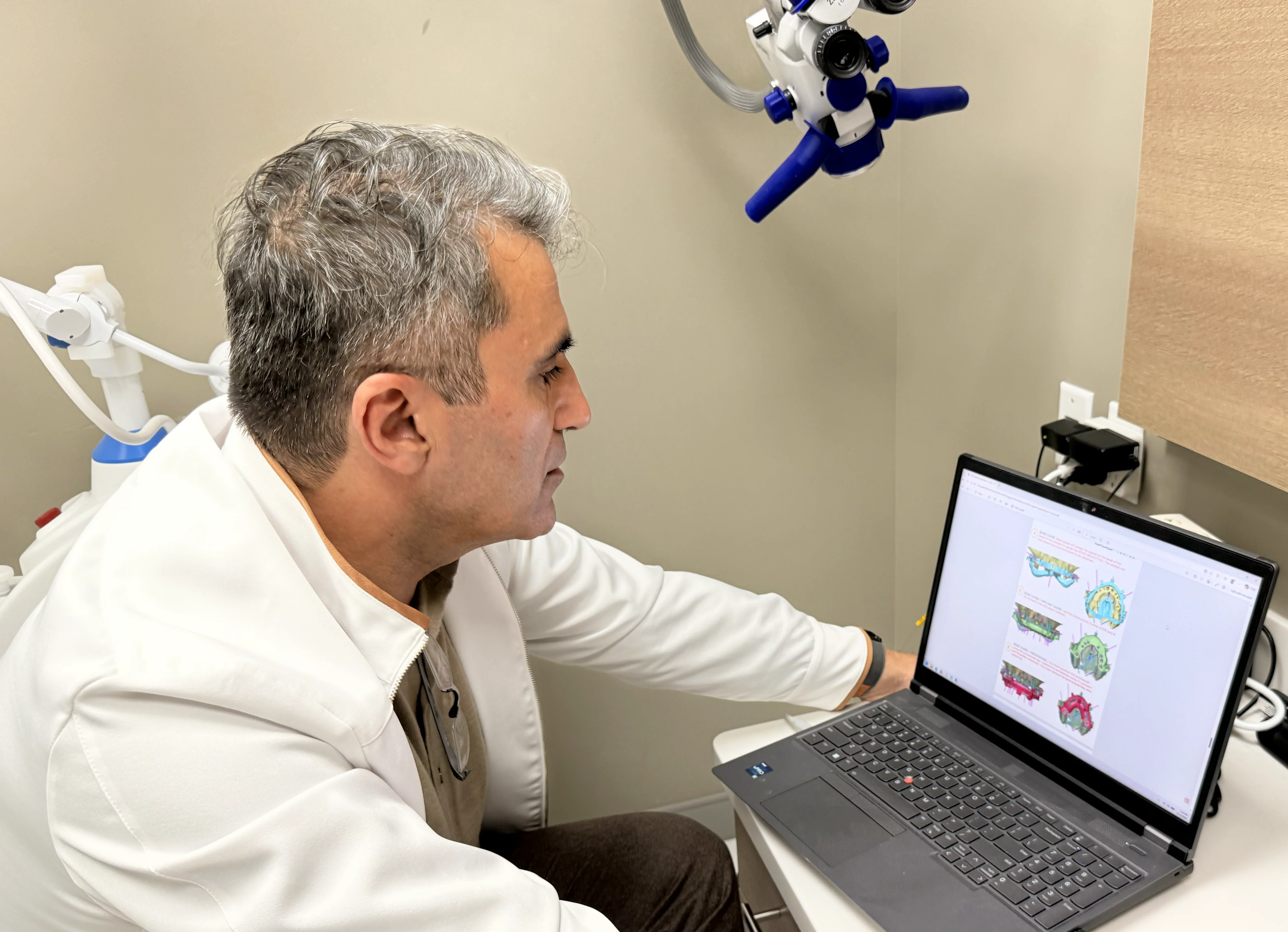Dr. Baghdasaryan planning a surgery for an All-on-6 full mouth implant case based on facially driven Digital Smile Design plan.